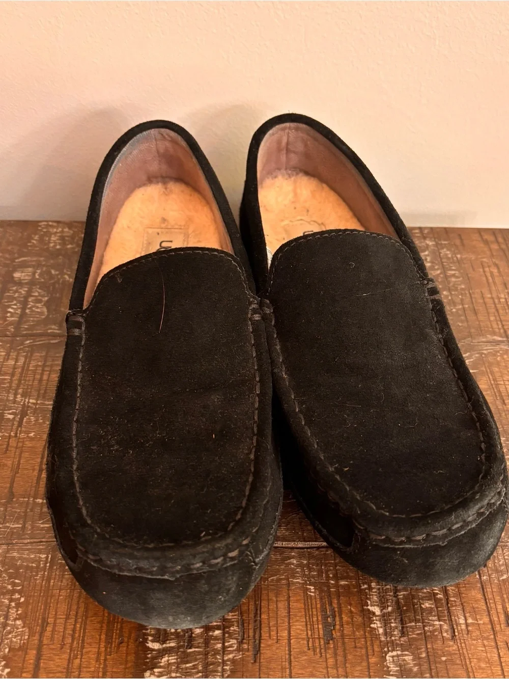 UGG Men's 10 Alder slippers crafted in black suede with a classic moc-toe stitch